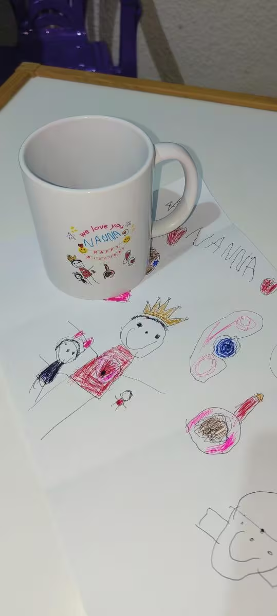 Personalized mug with children's drawings and 'We Love You Nanna' message